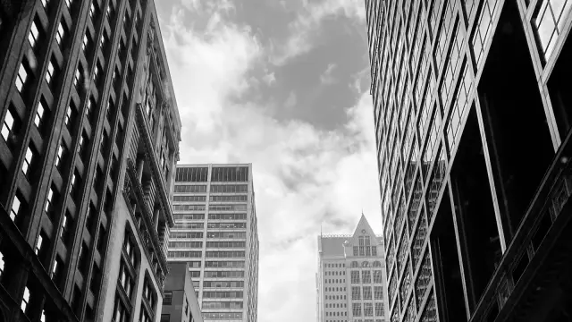 Looking up between downtown high rise buildings
